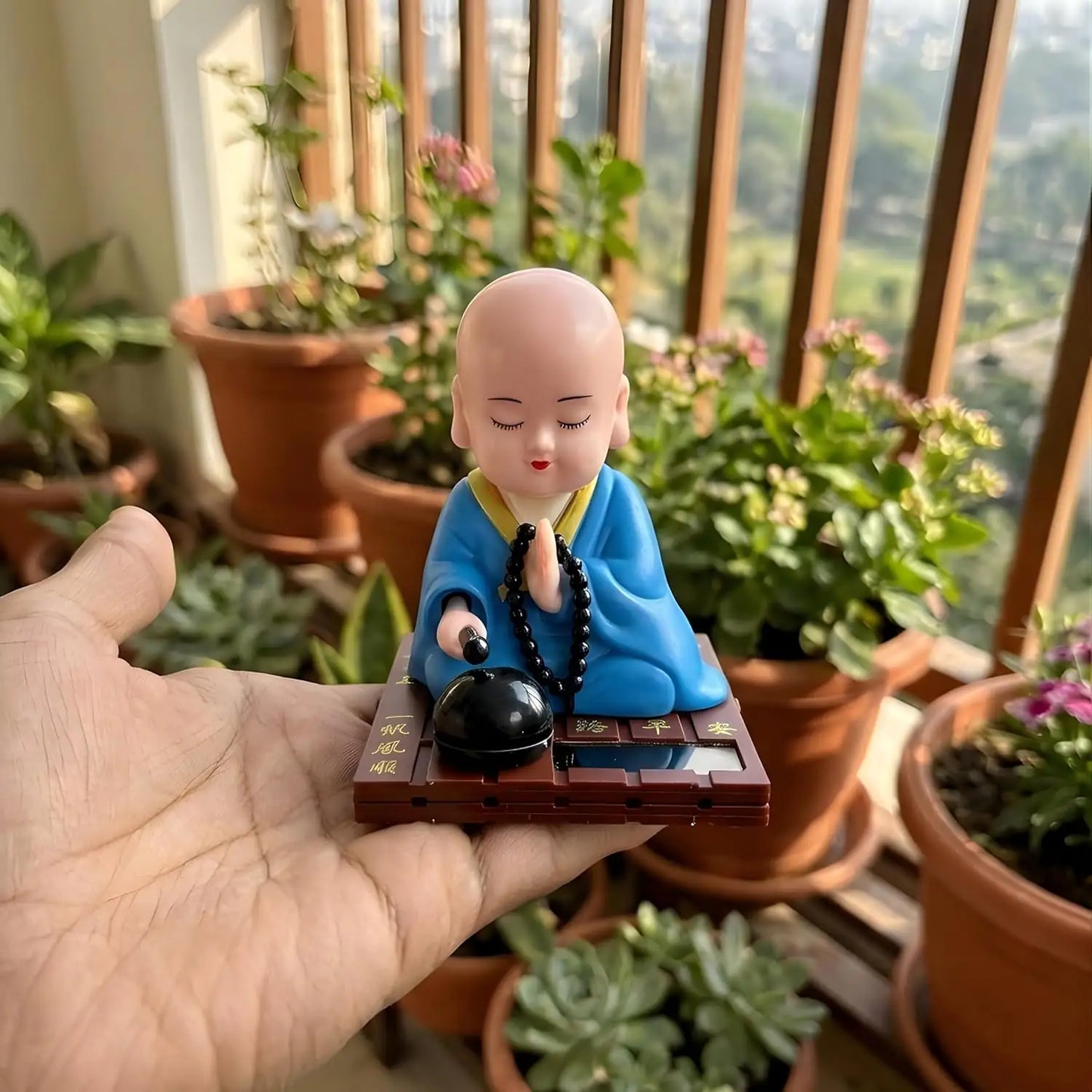 solar buddha moving head idol